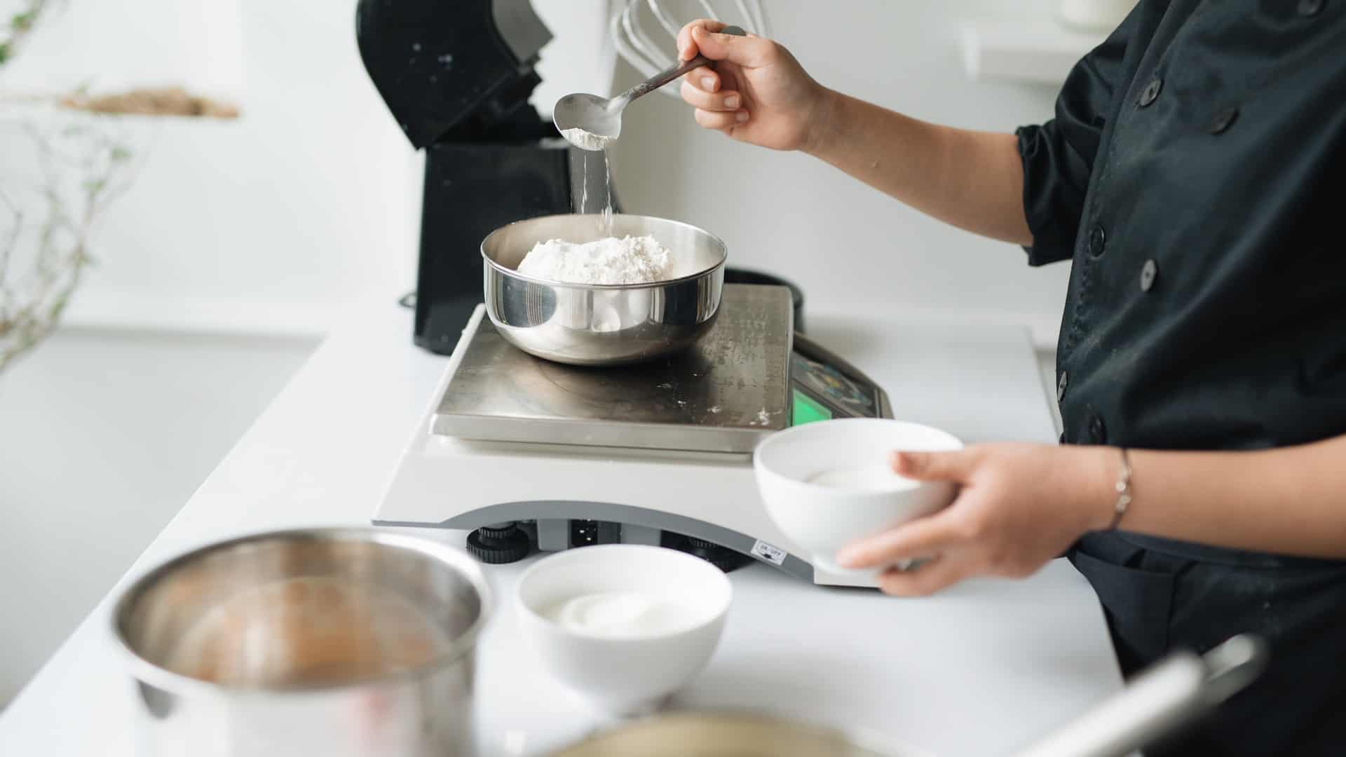 Person measuring ingredients for baking