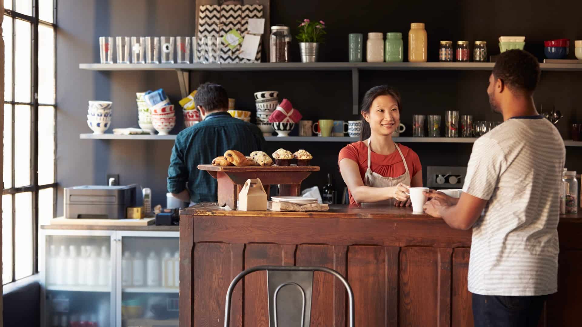 Barista serving customers