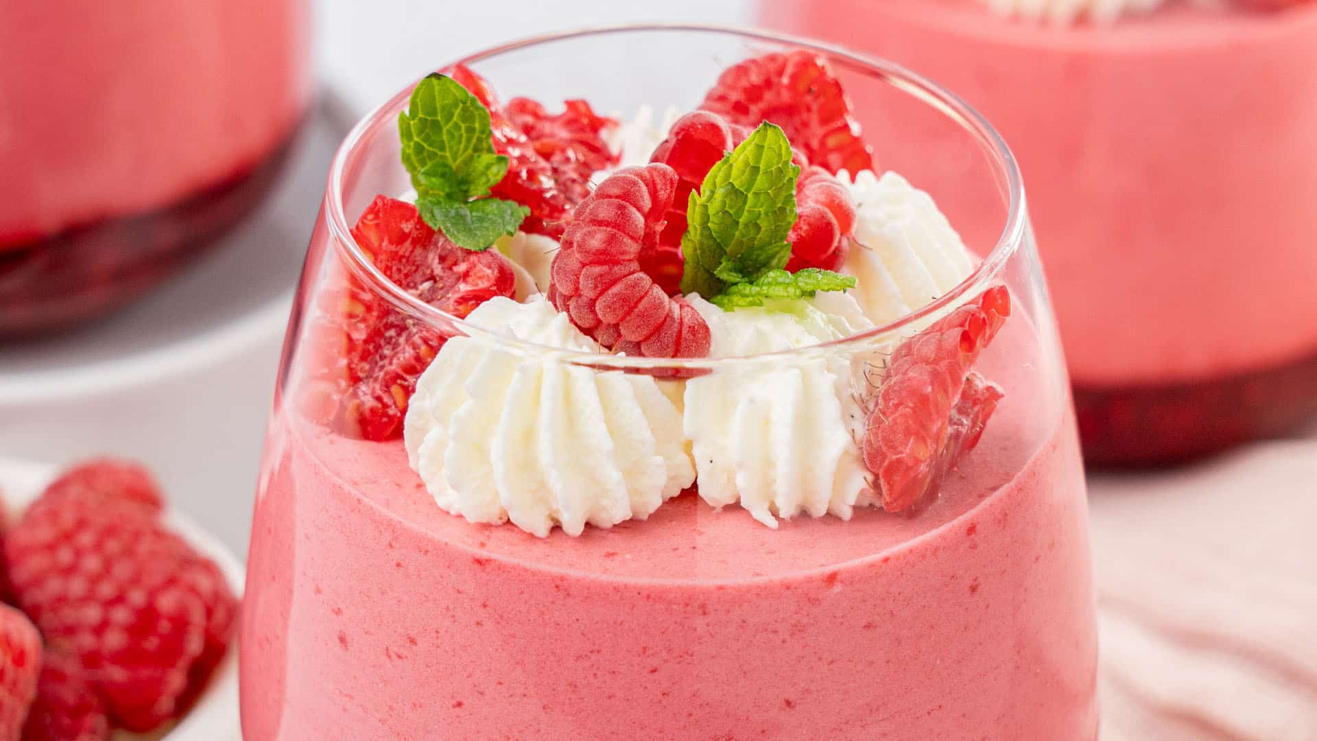 Raspberry mousse in a glass.