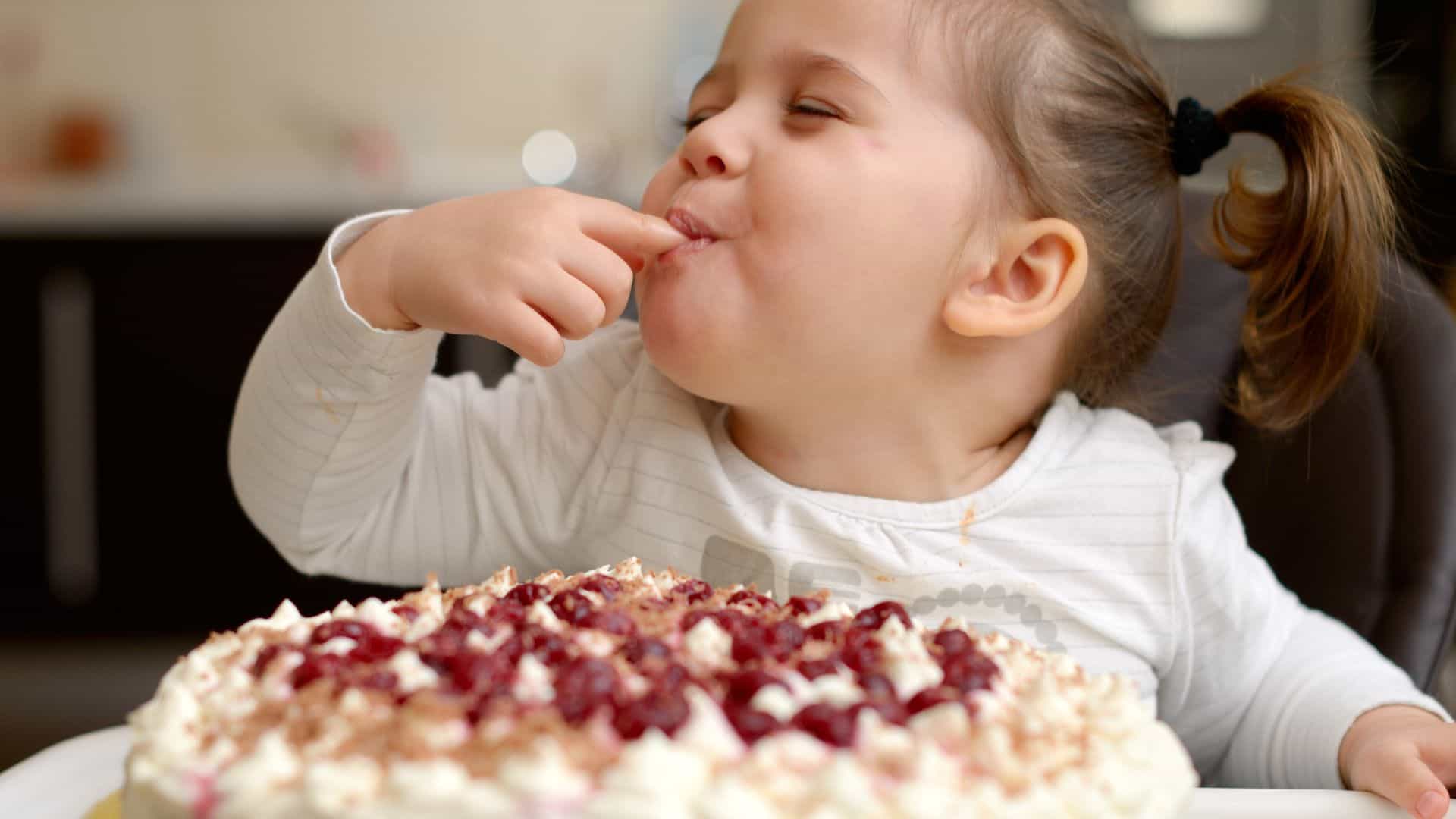 kid eating cake