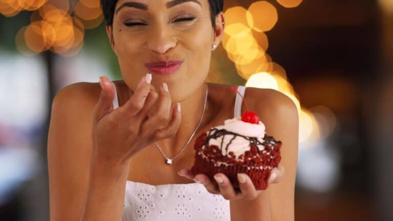 woman eating cupcake